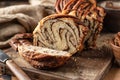 Chocolate Babka or Brioche Bread. Homemade sweet yeast pastry chocolate swirl bread sliced on wooden rustic board Royalty Free Stock Photo