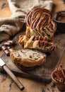 Chocolate Babka or Brioche Bread. Homemade sweet yeast pastry chocolate swirl bread sliced on wooden rustic board Royalty Free Stock Photo