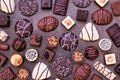 Chocolate background with an assortment of fine, luxurious sweets on a dark stone background Royalty Free Stock Photo