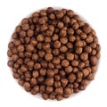 Chocolate balls corn flakes in white bowl isolated, top view. Cereals. Royalty Free Stock Photo