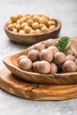 Chocolate balls filled with hazelnuts on a white background Royalty Free Stock Photo
