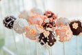 Chocolate balls with glaze flowers put on white sticks