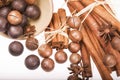 Chocolate balls cinnamon sticks and macadamia nuts