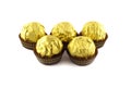 Chocolate balls wraped in the golden package isolated on white Royalty Free Stock Photo