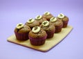 Chocolate banana muffins set on wood board