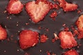 Chocolate bar with freeze dried strawberries as background, closeup Royalty Free Stock Photo