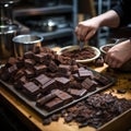 Chocolate bar in the hands of a professional barista, close-up