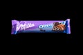 Odessa, Ukraine - June 03, 2022: Chocolate bar Milka on a black background, top view