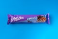 Odessa, Ukraine - June 03, 2022: Chocolate bar Milka on a blue background, top view