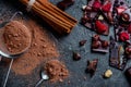 Chocolate bar with nuts and berries with cinnamon and sieve