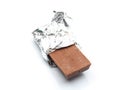 Chocolate bar with open aluminium wrapper Royalty Free Stock Photo