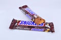 Chocolate bar snickers on a white background Royalty Free Stock Photo