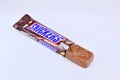 Chocolate bar snickers on a white background Royalty Free Stock Photo