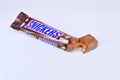 Chocolate bar snickers on a white background Royalty Free Stock Photo