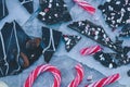 Chocolate bark pieces with peppermint candy bits and striped candy canes