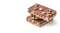 Chocolate bars layered with crunchy almonds and hazelnuts, sitting appetizingly against pristine white backdrop, showcasing rich, Royalty Free Stock Photo