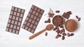 Chocolate bars with cocoa beans and bowl of chocolate chips and cacao powder Royalty Free Stock Photo