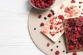 Chocolate bars with freeze dried fruits on white wooden table, top view. Space for text Royalty Free Stock Photo