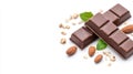 Chocolate bars resting on white surface, scattered with almonds, puffed rice, mint leaves in appetizing culinary composition Royalty Free Stock Photo