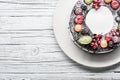 chocolate berry cake on plate over white wooden background Royalty Free Stock Photo