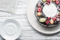 chocolate berry cake on plate over white wooden background Royalty Free Stock Photo