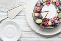 chocolate berry cake on plate over white wooden background Royalty Free Stock Photo