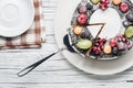 chocolate berry cake on plate over white wooden background Royalty Free Stock Photo