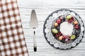 chocolate berry cake on plate over white wooden background Royalty Free Stock Photo