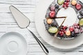 chocolate berry cake on plate over white wooden background Royalty Free Stock Photo