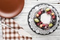 Chocolate berry cake on plate over white wooden background Royalty Free Stock Photo