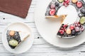 Chocolate berry cake on plate over white wooden background Royalty Free Stock Photo