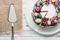 Chocolate berry cake on plate over white wooden background Royalty Free Stock Photo