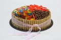 Chocolate birthday cake with candy on top
