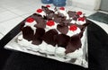 Chocolate birthday cake with cherry decoration