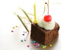 Chocolate birthday cake with cherries and cream