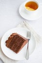 Chocolate Birthday cake. A slice of delicious chocolate cake on a light background. Piece of Cake on a white Plate. Sweet food. Royalty Free Stock Photo