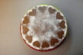 Chocolate Biscuit Cake with Cocoa Cream with Small Hearts from Powdered Sugar. Dessert. Valentine`s Day Concept. Flat Lay Top Vie