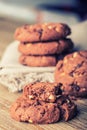 Chocolate biscuit cookies. Chocolate cookies on white linen napkin on wooden table Royalty Free Stock Photo