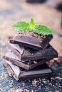 Chocolate. Black chocolate. A few cubes of black chocolate with mint leaves. Royalty Free Stock Photo