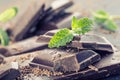 Chocolate. Black chocolate. A few cubes of black chocolate with mint leaves. Royalty Free Stock Photo