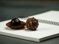 Chocolate bonbons on a spiral notebook