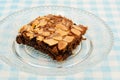 Chocolate brownie with almond topping on glass plated Royalty Free Stock Photo