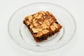 Chocolate brownie with almond topping on glass plated Royalty Free Stock Photo