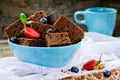 Chocolate brownie cake decorated with strawberry and blueberry Royalty Free Stock Photo