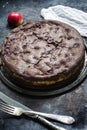 Chocolate brownie cheesecake on dark background. Selective focus