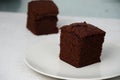 Chocolate Brownie in plate isolated on white background Royalty Free Stock Photo