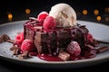 Chocolate brownie with a scoop of ice cream and raspberries Royalty Free Stock Photo