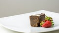 Chocolate brownie and strawberries Royalty Free Stock Photo
