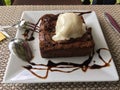 Chocolate brownie topped with coconut ice cream Royalty Free Stock Photo