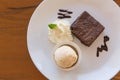 Chocolate brownie with vanilla ice cream, whipping cream served Royalty Free Stock Photo